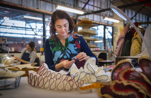 Madeleine Somers works on one of the show's many hand-sewn ruffs.