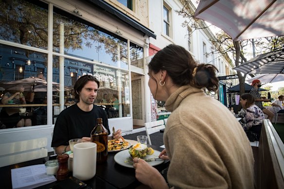 People enjoy outdoor dining on Gertrude street in Fitzroy.