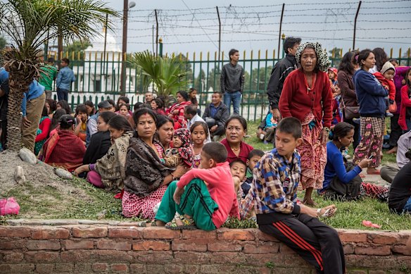 Kathmandu's residents sit in open spaces as replicas of the earthquake hit the city following an earthquake on in Kathmandu, Nepal. 
