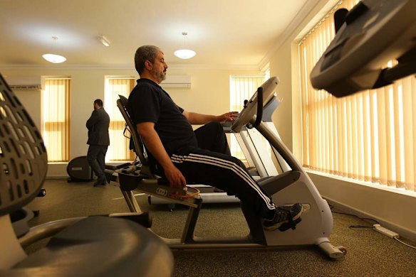 Khalid Mishal works out in a friends private gym in Doha, Qatar.