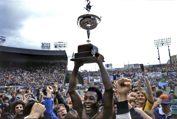 We are the champions: Hoisting the North American Soccer League trophy aloft with New York Cosmos in 1977. 