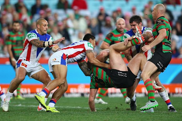 Getting horizontal: George Burgess is slammed to the ground.