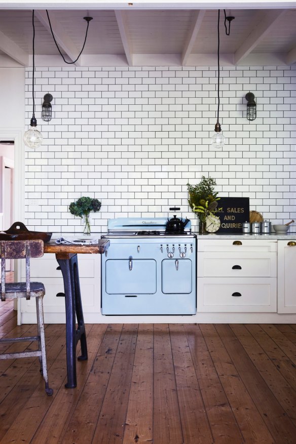 In the industrial-style kitchen, a pale-blue vintage oven was “the starting point for the whole room,” says Kali. “I designed everything else around it.”