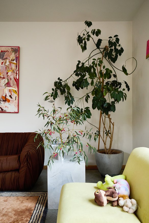 “When we moved in, every internal wall was covered in plywood, so we had to
decide which walls to plaster,” says Lafian. The yellow chair is from Mood Objects.
