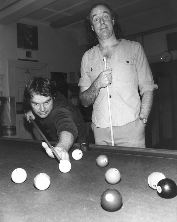 John Clarke's alter ego, New Zealand sociological commentator Fred Dagg, right, plays a round of snooker with 2JJ morning disc jockey Bob Hudson, February 1979. Picture supplied by ABC.