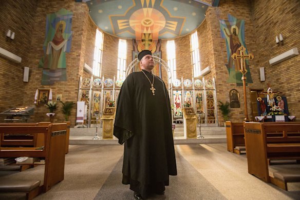 Father Simon Ckuj of the St. Andrews Ukranian Church poses for a picture after a service for the victims of Malaysia Airlines flight MH 17 that was shot out of the sky in Ukranian airspace on July 19, 2014 in Sydney, Australia.
