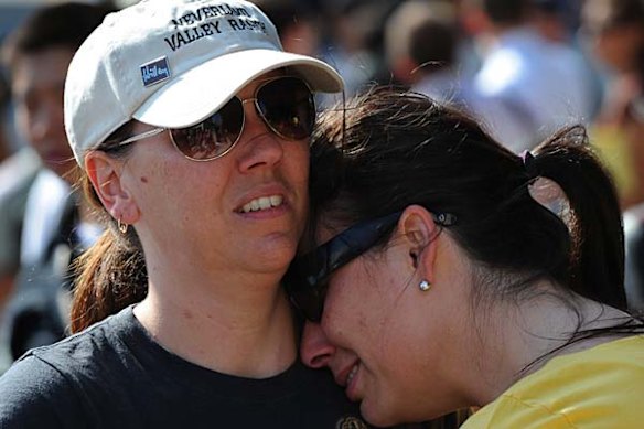 Fans weep and console each other outside the UCLA Medical Center following the death of music legend Michael Jackson.