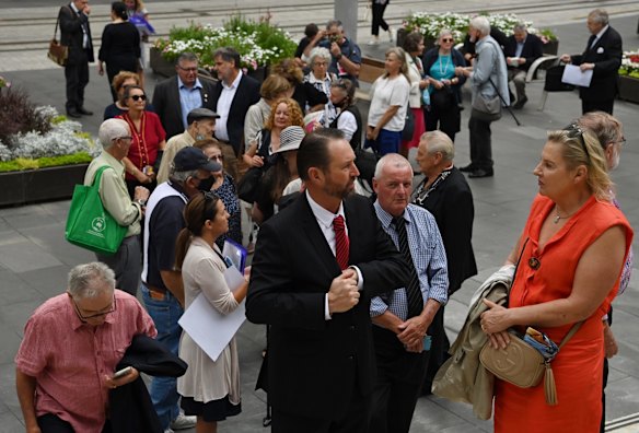 People arrive for the memorial of Jack Mundey AO.