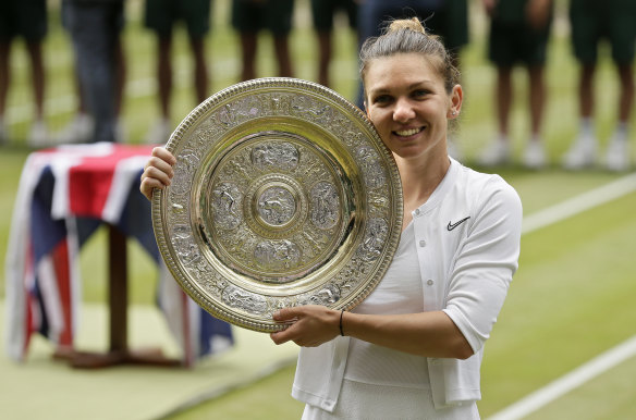 Romania's Simona Halep poses with her trophy.