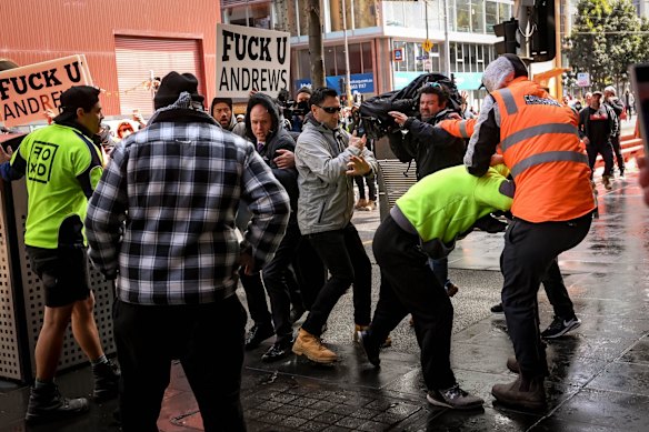 Media crew attacked by protesters.