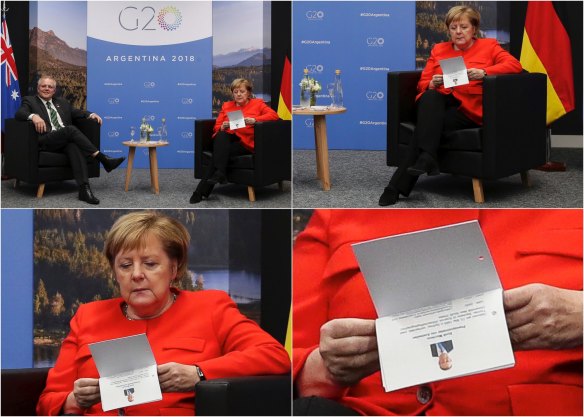 German Chancellor Angela Merkel checking her notes during a bilateral meeting with Prime Minister Scott Morrison at the G20 summit.