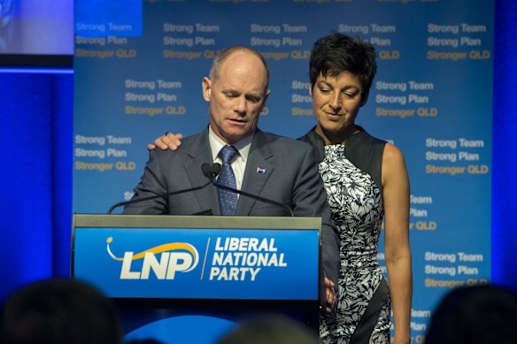 Campbell Newman, with his wife Lisa, speaks to LNP supporters in the wake of losing Ashgrove.