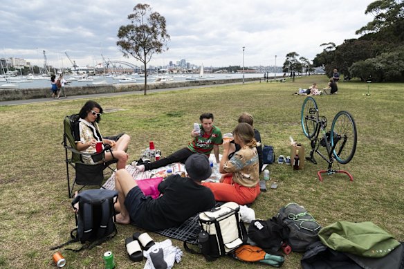Groups picnic at Rushcutters Bay, as restrictions slightly ease.