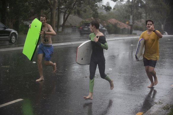 Teenagers make the most of the wet conditions in Roseville.