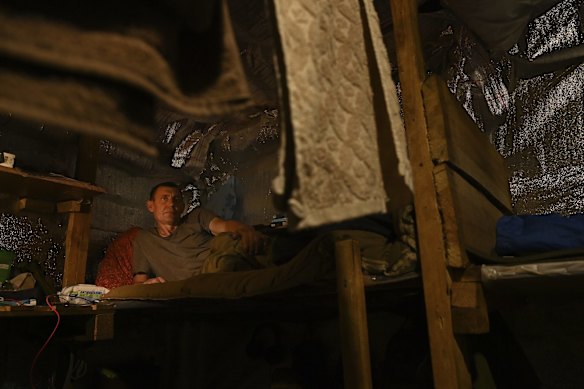 Ukrainian soldier Bondik 48yrs rests in the bunker at a position on the frontline near Krasnohorivka. Bondik considers himself very lucky as a Grad missile one month ago slammed through the wall and landed under the bunk opposite him without exploding. Donetsk Oblast, Ukraine.
