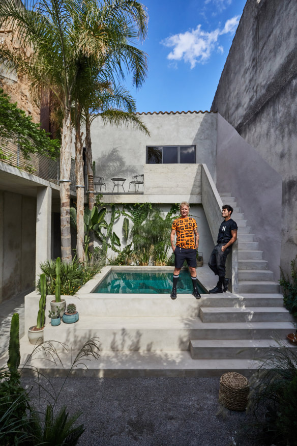 Gary Chard (left) and Feskie Rodriguez by the pool. “Our philosophy was to build a house that would mature and age gracefully,” says Chard. “It was never about chasing perfection. We wanted marks and imperfections to be part of its story.”