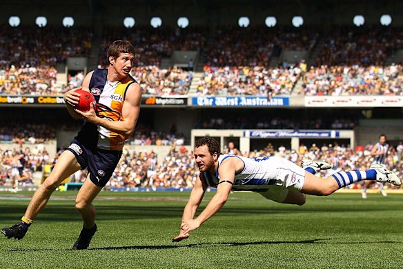 Patrick McGinnity evades a diving Scott McMahon. 
