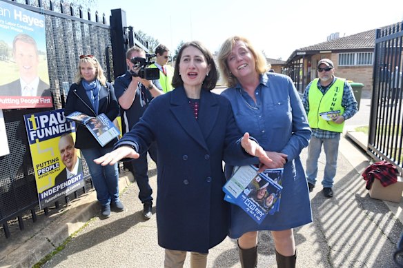 Gladys Berejiklian with Julia Ham at a polling venue this morning waiting for early voters to arrive.
