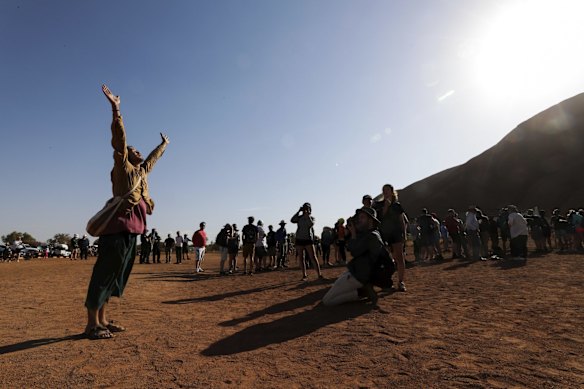 Japanese man Hikaru Ide pays his respect to Uluru and the wishes of the traditional owners and has chosen not to climb, at the base of the climb on the final day it is allowed.