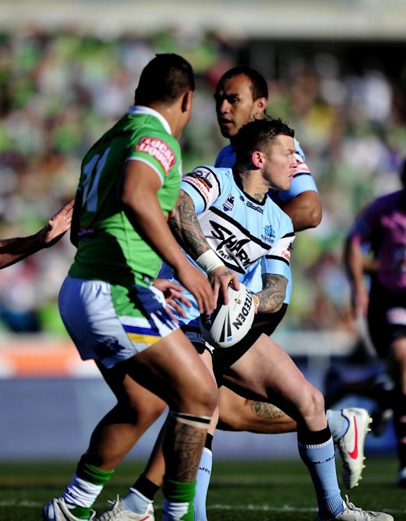 Todd Carney looks to pass the ball.