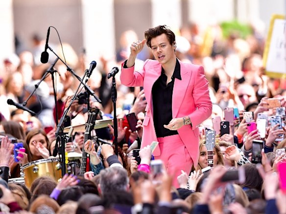 What can’t Harry Styles wear? Styles took centre stage for his solo music debut on the Today show, sporting a bespoke suit from English tailor Edward Sexton. The pink custom suit is his latest 70s inspired outfit. It featured a single button and powerful shoulder. 
Styles has been known to wear "rock star pink" proudly, with some fashion experts saying this look had a Bowie-esque meets Elvis Presley vibe. Style note: It's time to rethink pink; match bubblegum or 'millennial pink' suiting, pants and skirts with black to bring a rock star vibe to your look.