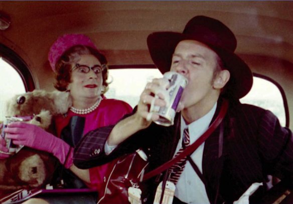 Barry Humphries in character as Aunt Edna with Barry Crocker (right) in a London taxi during filming of The Adventures of Barry McKenzie.
