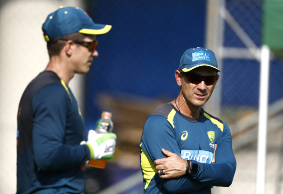 Tension: Justin Langer and Tim Paine.