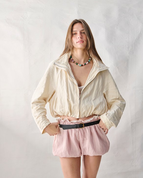 Bianca Spender “Aether” jacket,
$725. LMND mesh bra, $119. Zara shorts, $70. Reliquia “Toga” necklace, $179. Model’s own belt.