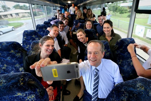 Opposition Leader Bill Shorten takes a selfie with media on the campaign bus on the way to to Beaconsfield State School in Mackay, Queensland. Wednesday 11 May 2016.