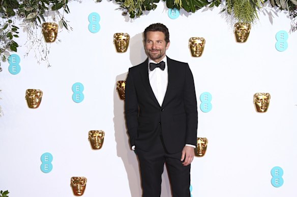 Director and actor Bradley Cooper poses for photographers upon arrival at the BAFTA awards in London.