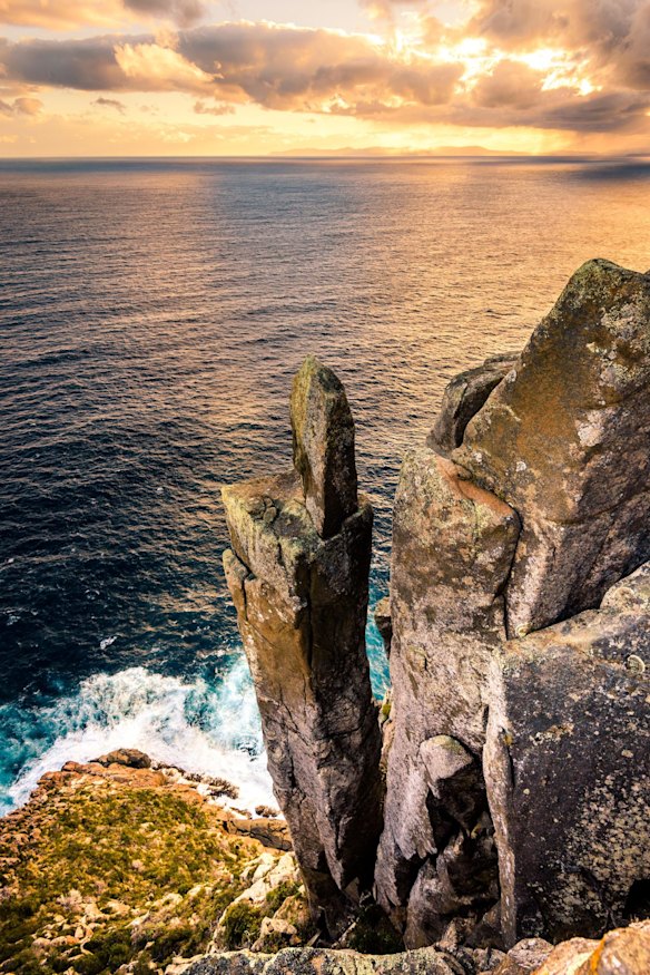 CAPE RAOUL: In a sense, Cape Raoul is the Tasman Peninsula's forgotten cape. Intended as the third cape on the Three Capes Track, it now sits blissfully removed from the multiday walk, but a recent track upgrade has smoothed the way for day walkers. From the trailhead just south of Port Arthur, the walk rises to a high cliff edge - left from here lies Cape Raoul and right leads down to the surfing sensation of Shipstern Bluff. The track to the cape tapers down beside the dwindling cliffs to arrive at the Tasman Peninsula's southernmost point, looking down onto a narrow and dramatic spine of dolerite towers stepping down into the Southern Ocean.