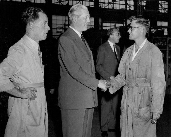 Mr MacMillan, Britain’s Prime Minister, pauses to have an informal chat with British migrants Tony Stoker (18) and Bill Briggs, both from Suffolk, England, and now employed by the British Motor Corporation (Australia) Pty Ltd. In the background is Lord Carrington, UK High Commissioner for the UK in Australia.