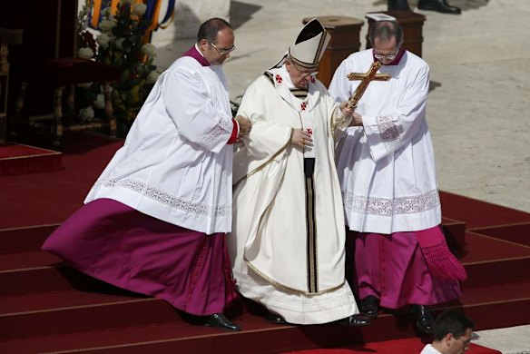 Pope Francis descends the stairs as he takes part in his inaugural mass in Saint Peter's Square.
