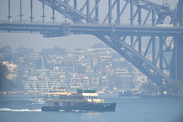 Ferries heading out into the smoke on Sydney Harbour.
