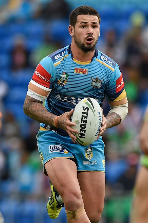 Nathan Peats of the Titans runs with the ball.