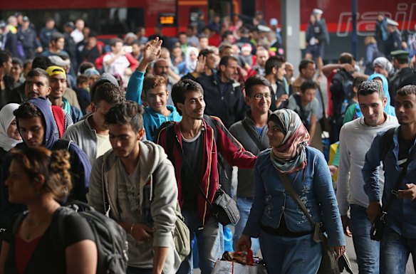 Migrants arrive on a train from Hungary at Munich Hauptbahnhof main railway station in Munich, Germany. 