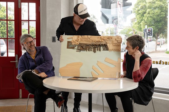 Architects Richard Healy Finlay, Neil Mackenzie and Heidi Pronk with their Barangaroo model from the early 2000s. 
