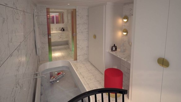 Features include a marble-clad bathroom with a "peek-a-boo" window overlooking the bedroom and ocean.