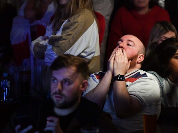 English soccer fans gather at Turf Sports Bar in Melbourne in the early hours of the morning to watch the Euro 2020 final between England and Italy being played at Wembley Stadium in London.