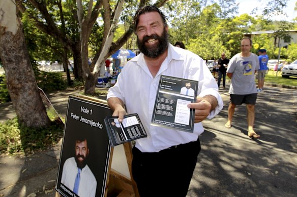 Independent candidate for Ashgrove Peter Jeremijenko campaigns outside Payne Road State School on election day. 