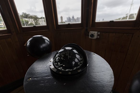 The compass inside the idle wheelhouse of the old South Steyne ferry.