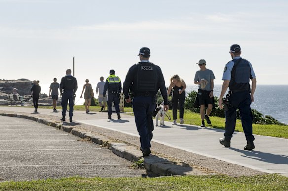 Police patrol Maroubra Beach to enforce social distancing rules to stop the spread of coronavirus. 