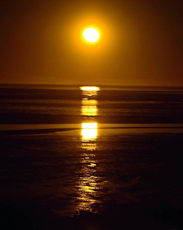 View from Town Beach of the Staircase to the Moon phenomenon, which happens across Roebuck Bay, Broome, WA. The experience: Full-moon moments on the pristine Kimberley coast. Qantas and Virgin fly to Broome from Sydney and Melbourne via Perth. Cable Beach Club Resort and Spa studio rooms from $199 a night. cablebeachclub.com