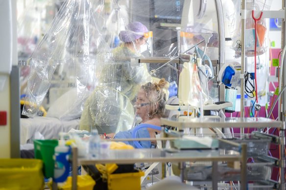 COVID-19 patient Maria Roessen who has spent ten days in hospital including seven in the ICU ward. Maria has an underlying lung condition and is very lucky to be alive thanks to being double vaccinated. Maria is being tended to by ICU nurse Montana McQuade.