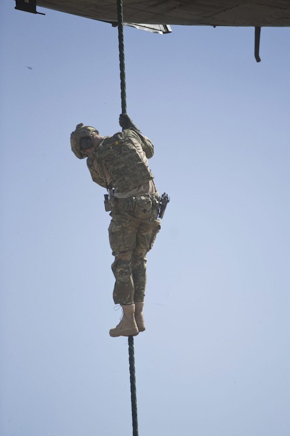 Captain Wales fast ropes during a counter-terrorism exercise.