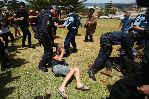 Police take control after a scuffle broke out with demonstrators opposing the Party for Freedom gathering.