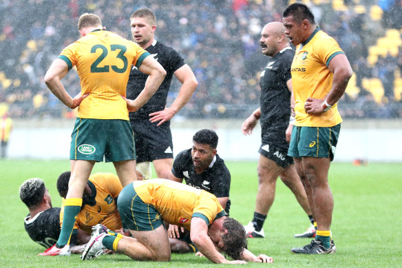 Players react after James O'Connor put the ball out to end the match.