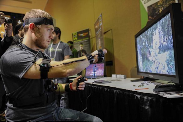 An exhibitor demonstrates a YEI Technology PrioVR game suit.