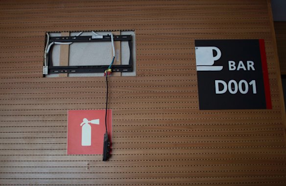 Cables from a stolen TV hang inside Maracana stadium which was renovated for the 2014 World Cup at a cost of about $500 million, and largely abandoned after the Olympics and Paralympics, then hit by vandals.