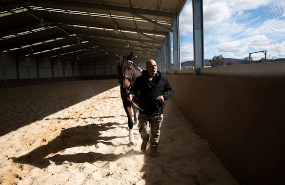 Retired serviceman Max Streeter, who suffers from PTSD, interacts with Vashka, a retired racing horse, as part of a equine therapy program run by Racing NSW in Capertee, NSW.